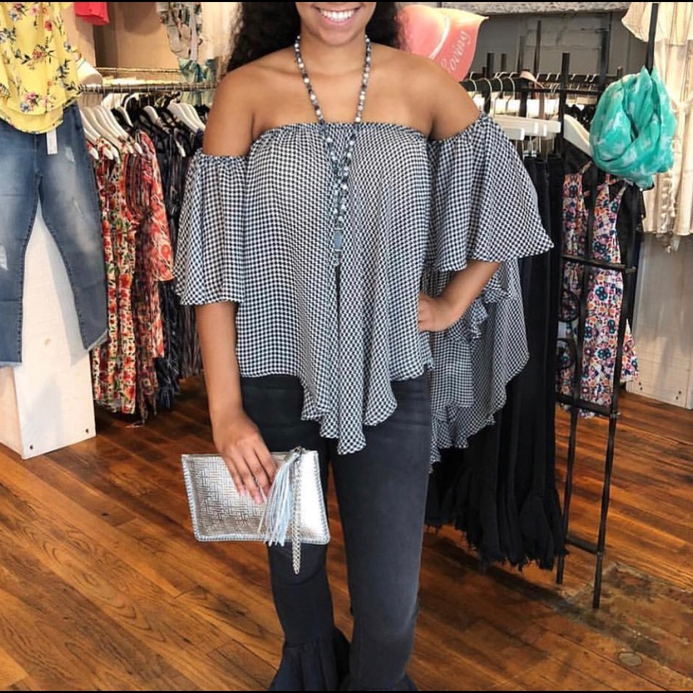 Houndstooth off the shoulder blouse .